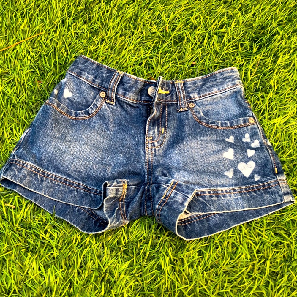 Jean shorts size 8 with bleached hearts!